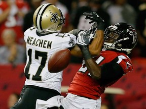 Atlanta cornerback Desmond Trufant, right, breaks up a pass intended for New Orleans wide receiver Robert Meachem on November 21, 2013 in Atlanta.  (Kevin C. Cox/Getty Images)