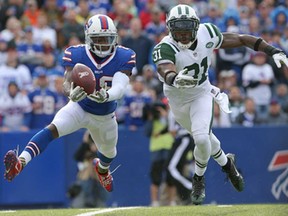 Buffalo's Marquise Goodwin, left, reaches for a pass during NFL action against New York's Antonio Cromartie at Ralph Wilson Stadium on November 17, 2013 in Orchard Park, New York. (Tom Szczerbowski/Getty Images)