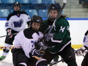 Belle River's Andrea Parr, right, battles Villanova's Lauren Jedinski in front of the net during girls high school hockey at the Vollmer Centre on Thursday, November 28, 2013. The game ended in a 2-2 tie.  (TYLER BROWNBRIDGE/The Windsor Star)