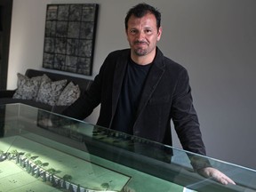 Gino Piccioni, president of Timberland Homes, stands next to a model display of The Enclave at Legacy Grove at their welcome centre in LaSalle.  (DAX MELMER/The Windsor Star)