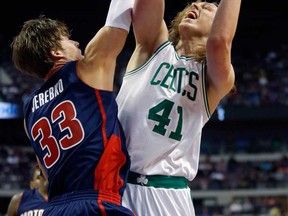 Boston's Kelly Olynyk, right, takes a shot against Detroit's Jonas Jerebko Sunday, Nov. 3, 2013, in Auburn Hills, Mich. (AP Photo/Duane Burleson)