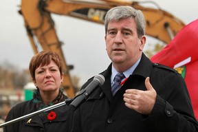 Glen Murray, Minister of Transportation and Minister of Infrastructure, is joined by MPP Teresa Piruzza, Minister of Children and Youth Services, as they announce that the 500 girders being used on the Herb Grey Parkway project will be replaced, Friday, Nov. 1, 2013.  (DAX MELMER/ The Windsor Star)