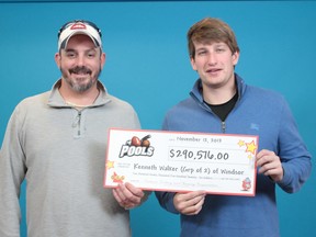 Kenneth Walker (L) and Sam Katzman (R) hold their $290,576 cheque from the OLG on Nov. 12, 2013. (Handout / The Windsor Star)