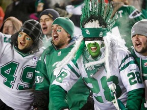 Saskatchewan Roughriders fans celebrate winning the CFL West Final in Calgary, Alta., Sunday, Nov. 17, 2013. The Roughriders beat the Calgary Stampeders 35-13. (THE CANADIAN PRESS/Jeff McIntosh)