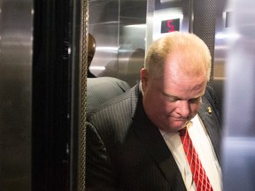 Toronto Mayor Rob Ford leaves his city hall on Nov. 18, 2013, after a disastrous council session. (Chris Young / Canadian Press)