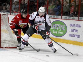 Windsor's Kerby Rychel, right, fights for the puck with Owen Sound's Alex Annecchiarico in OHL action at the WFCU Centre, Saturday, November 2, 2013. The Spits won 6-0. (REBECCA WRIGHT/ The Windsor Star)