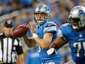 Detroit QB Matthew Stafford looks to throw a pass against the Dallas Cowboys at Ford Field on October 27, 2013 in Detroit. (Gregory Shamus/Getty Images)
