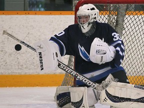 Tecumseh Vista goalie Matthew Reaume makes a save during a game against St. Joseph Wed. Nov. 27, 2013, at the Tecumseh Arena. (DAN JANISSE/The Windsor Star)