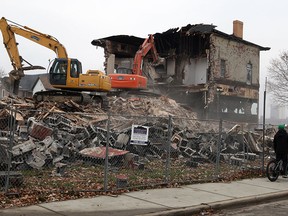 Historic Belleview Tavern and later,  Danny's Tavern, is being demolished by Rudak Contractors Wednesday December 4, 2013.  (NICK BRANCACCIO/The Windsor Star)