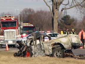 Chatham-Kent police investigate a fatal motor vehicle accident between a pickup truck and a tractor-trailer on Queen's Line, about 200 metres east of Dillion Road, Saturday, Dec. 7, 2013.  One person reportedly died at the scene.   (DAX MELMER/The Windsor Star)