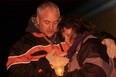 Guy and Debbie Leveille hold a candle in remembrance of their son, Jesse Lee, at the Safety Village for the Compassionate Friends Worldwide Candle Lighting Saturday, Dec. 8, 2013. (JOEL BOYCE/The Windsor Star)