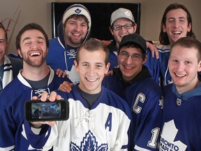 Toronto Maple Leafs fans, from left, Ivan Kolar, 22, Marc Berthiaume, 22, Eric Bauer, 23, Sean Micelli, 22, Trevor Crevatin, 24, Ryan Boutette, 24, Mark Micelli, 23, and Dylan Berthiaume, are pictured at the Micelli residence, Saturday, Dec. 14, 2013, where they watched Game 7 between the Boston Bruins and the Toronto Maple Leafs in last season's playoffs.  A video of them watching the game has gone viral and Sports Illustrated is featuring the group of friends for a year in review issue.  (DAX MELMER/The Windsor Star)