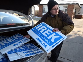 Irek Kusmierczyk, newly elected Ward 7 councillor, picks up his campaign signs in Forest Glade and meets with the public and media around the city, Tuesday December 10, 2013. (NICK BRANCACCIO/The Windsor Star)