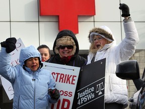 Striking Red Cross Care Partners (RCCP) Olga Corra, left, Fran Martens and Millie Hickson, had plenty of energy on the picket line on Grand Marais Road East  Dec. 11, 2013. Union leaders are hopeful a January arbitration hearing will help to end the work disruption. (Windsor Star files)