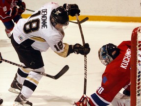 LaSalle's Dylan Denomme, left, is stopped by Strathroy goalie Dalen Kuchmey in 2011. (NICK BRANCACCIO/The Windsor Star)