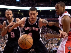 San Antonio's Danny Green, left, is guarded by Toronto's Kyle Lowry. (THE CANADIAN PRESS/Frank Gunn)