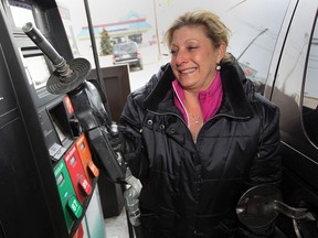 Tracy St. Pierre put $50 in her gas tank at 7-Eleven on McDougall Avenue and Tecumseh Road E.  St. Pierre was commenting on a proposed hike in gasoline tax Thursday December 12, 2013. (NICK BRANCACCIO/The Windsor Star)