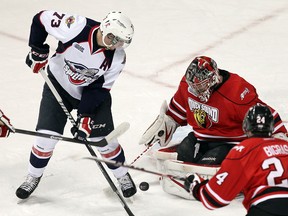 Windsor's Remy Giftopoulos, left, is stopped by Owen Sound goalie Brandon Hope at the WFCU Centre.     (TYLER BROWNBRIDGE/The Windsor Star)