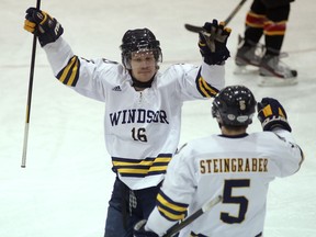 Windsor's Steve Ferry, left, and Christian Steingraber celebrate a goal against Guelph. (DAN JANISSE/The Windsor Star)