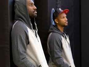 New Toronto Raptors Patrick Patterson, left, and Chuck Hayes watch practice in Toronto Wednesday. (THE CANADIAN PRESS/Frank Gunn)