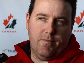 Team Canada coach Dan Church speaks to reporters in April. (THE CANADIAN PRESS/Sean Kilpatrick)