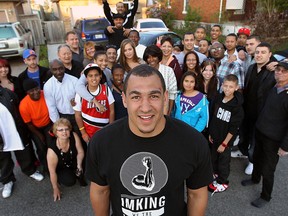 Windsor's Tyrone Crawford, front, is joined by family and friends as he waited for the results from the NFL draft in 2012. (TYLER BROWNBRIDGDE/The Windsor Star)