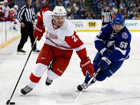 Detroit's Brendan Smith, left, is checked by Tampa Bay's Nikita Kucherov during a regular season game, will return to Detroit's lineup for Game 3 of their playoff series with Tampa Bay.