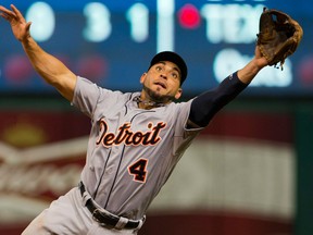 Tigers second baseman Omar Infante leaps for a line drive against the Indians at Progressive Field. (Photo by Jason Miller/Getty Images)