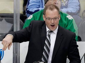 Pittsburgh coach Dan Bylsma, top, gives instructions to Sidney Crosby Friday against the Devils. (AP Photo/Gene J. Puskar)