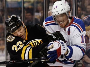 Boston's Shawn Thornton, left, checks New York's Marc Staal.  (AP Photo/Winslow Townson)