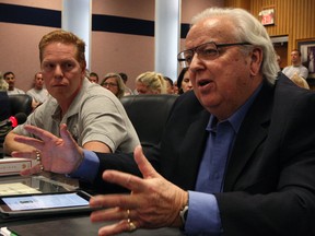 Patrick Burke, right, and Angelo Gertsakis, president Windsor Fire Fighters Assoc.Windsor firefighters attend Windsor City Council meeting Monday December 16, 2013. (NICK BRANCACCIO/The Windsor Star)