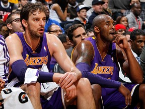 Los Angeles forward Pau Gasol, left, and Kobe Bryant look on against the Hawks at Philips Arena Monday. (Photo by Kevin C. Cox/Getty Images)