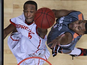 Windsor's Stefan Bonneau, left, battles for a rebound with Moncton's Anto Raic as the Windsor Express host the Moncton Miracles at the WFCU Centre, Sunday, Dec. 8, 2013. Windsor defeated Moncton 115-101. (DAX MELMER/The Windsor Star)