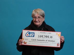 Carol Dumoulin holds a mock winning ticket. (Handout)