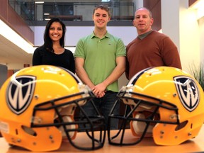 University of Windsor graduate students Suzanne Ali, left, and Michael Hatten, shown here with Jules Woolf, U of W sports management professor, researched concussions and contact sports at the U of W.  (JASON KRYK/The Windsor Star)