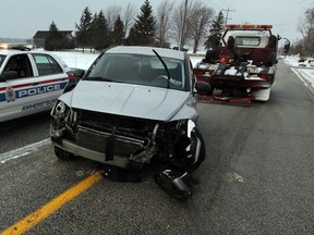 Amherstburg police and County Towing were at the scene on Concession 3,  where a Dodge Caliber slid from the roadway and ended up colliding with a culvert retaining wall  December 26, 2013.  The female driver was taken to hospital for assessment.  Blowing snow partially covered roadways in the county on Boxing Day.  Another accident occurred almost simultaneously on Concession 6 where a vehicle rolled over.  (NICK BRANCACCIO/The Windsor Star)