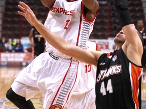 Windsor's Quinnel Brown, left, shoots over Ottawa's Ryan Anderson in the first quarter of action between the Windsor Express and the visiting Ottawa Skyhawks at the WFCU Centre, Sunday, Dec. 1, 2013.  (DAX MELMER/The Windsor Star)