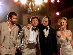 This film image released by Sony Pictures shows, from left, Amy Adams, Bradley Cooper, Jeremy Renner, Christian Bale and Jennifer Lawrence in a scene from "American Hustle." (AP Photo/Sony - Columbia Pictures, Francois Duhamel)