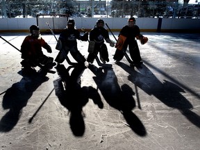 File photo of shadows of young hockey players cast on the ice at Lanspeary Park during the  Knobby's Kids goalie school held in Windsor, Ont., on Jan. 8, 2011.   Knobby's Kids Goalie School is a free program dedicated to teaching goalies the basic fundamentals and skills of goaltending.  (Jason Kryk/ The Windsor Star)