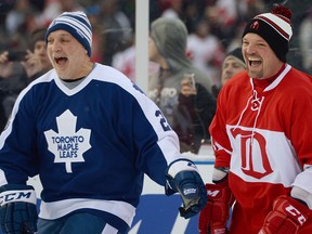 Detroit's Joey Kocur, right, laughs with Toronto's Tiger Williams during the 2013 Hockeytown Winter Festival Alumni Showdown at Comerica Park. (Photo by Jamie Sabau/Getty Images)