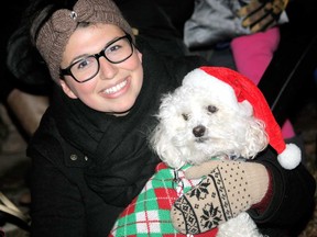 Debora Vagos and her dog, Riggins, wait for the Santa Claus Parade to start in Leamington Saturday, Nov. 30, 2013. (JOEL BOYCE/The Windsor Star)