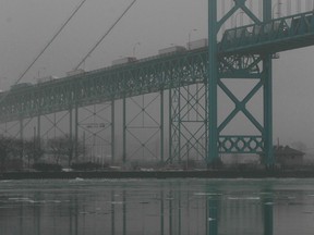 The Ambassador Bridge is shrouded in fog, Friday, Dec. 20, 2013. (DAX MELMER/The Windsor Star)