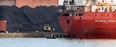 Fishermen troll for walleye on the Detroit River in front of Canadian Steamship Lines freighter Atlantic Huron which was taking on a load of petroleum coke April 15, 2013. (NICK BRANCACCIO/The Windsor Star)