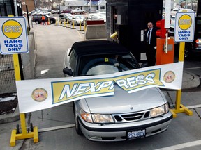 In this March 31, 2003 file photo, George Costaris, manager of political, economical, relations and public affairs for the Canadian Consulate in Detroit, drives his car through the Nexpress lane which opened that day at the Windsor-Detroit Tunnel. Nexpress leads a driver through to Nexus, which allows members who sign up to cross the border by showing their pass and it skips the usual custom checks other than spot checks. A third lane is planned for the tunnel. (Windsor Star files)