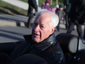 Hockey great Gordie Howe, the grand marshal of the Holiday Parade, makes his way down Ouellette Avenue in Windsor, Ont., Saturday, Nov. 30, 2013.  (DAX MELMER/The Windsor Star)