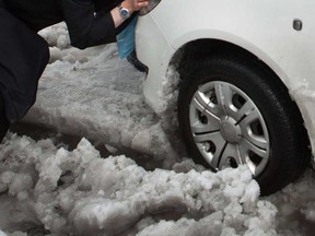 File photo of a vehicle being pushed in the snow. (Windsor Star files)