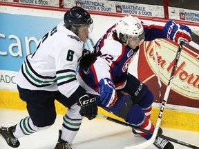 Plymouth's Mitch Jones, left, checks Windsor's Sam Povorozniouk at the  WFCU Centre. (NICK BRANCACCIO/The Windsor Star)