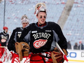 Detroit goalie Jimmy Howard takes a break at practice at Michigan Stadium in Ann Arbor Tuesday. (Photo by Gregory Shamus/Getty Images)
