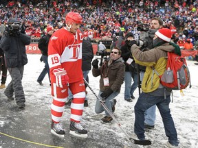 Detroit's Steve Yzerman walks to the ice before the first period of the Winter Classic Alumni outdoor game at Comerica Park in Detroit Tuesday. (AP Photo/Carlos Osorio)