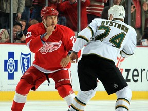 Detroit's Jordin Tootoo, left, fights Eric Nystrom of the Stars. (Photo by Dave Reginek/NHLI via Getty Images)